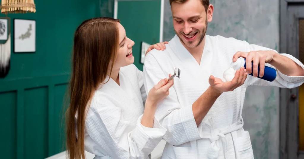a beautiful lady and a man are applying something on their hands