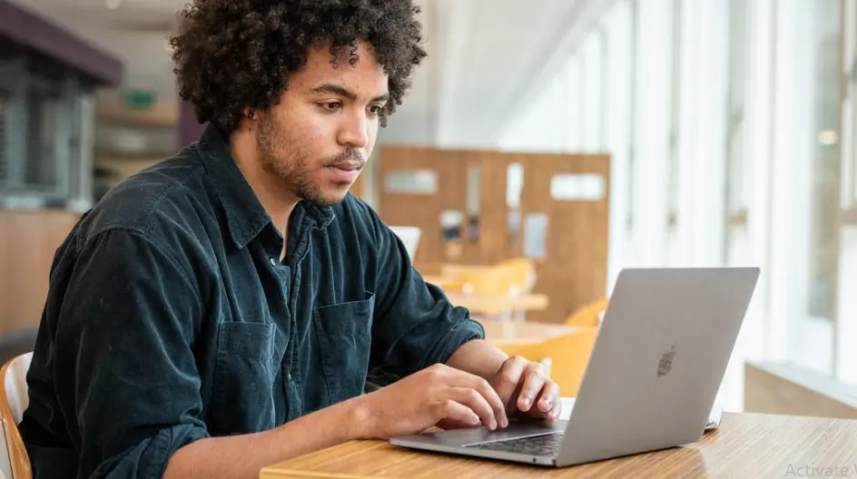 Person using a laptop to work with digital tools and AI applications.